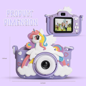 Cute pink kids' digital camera featuring a 1080P HD lens and a playful unicorn design with rainbow and clouds, shown with its included neck strap and USB charging cable. www.usmile.toys