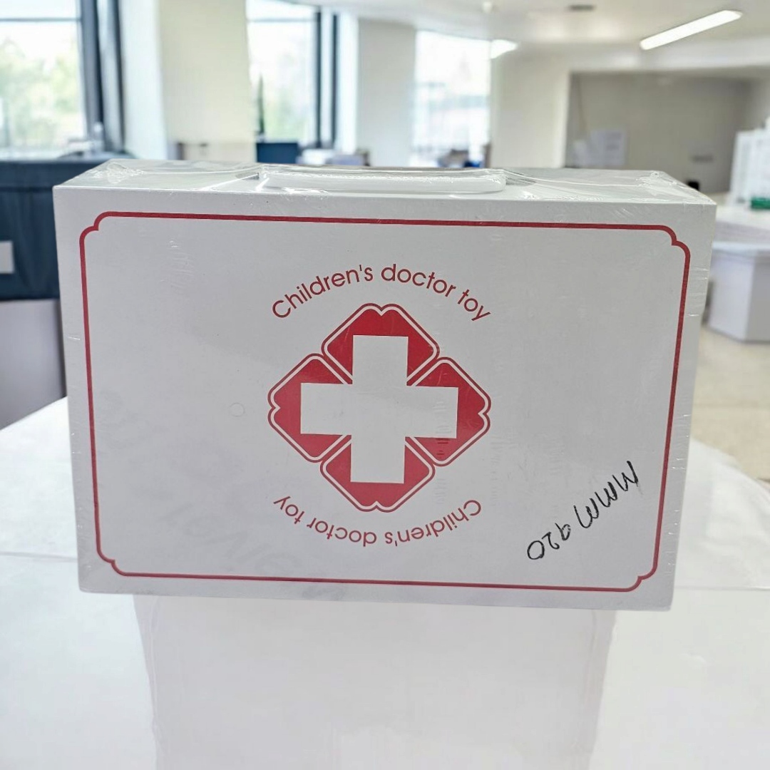 White box for a Usmile Toys Children's Doctor Toy, featuring a red medical cross logo, indicating a doctor or dentist play set for kids." www.usmile.toys