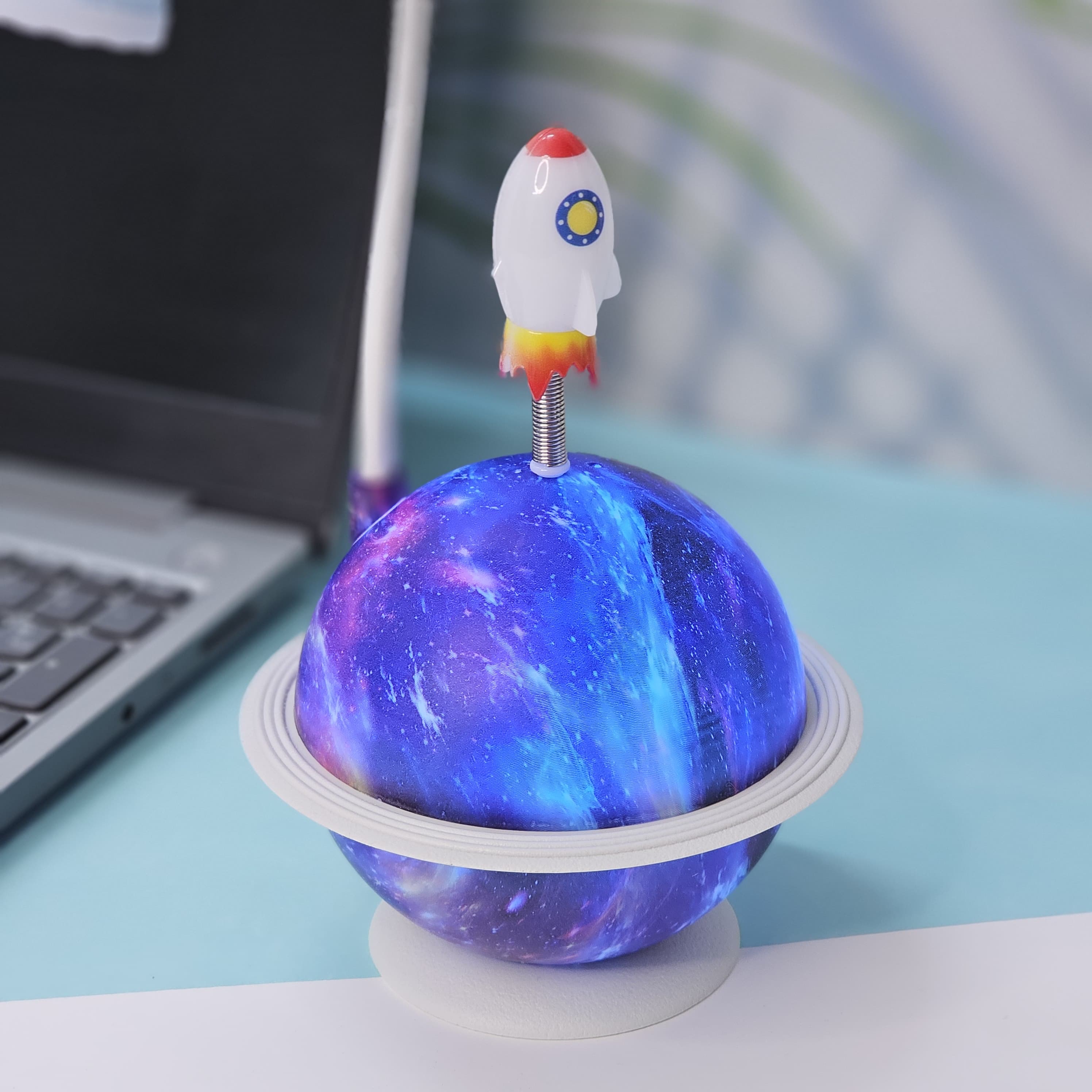 "Usmile Toys unique astronaut desk lamp, featuring a flexible neck, a light-up galaxy planet base, and a small rocket, ideal for a child's bedroom or study area." www.usmile.toys