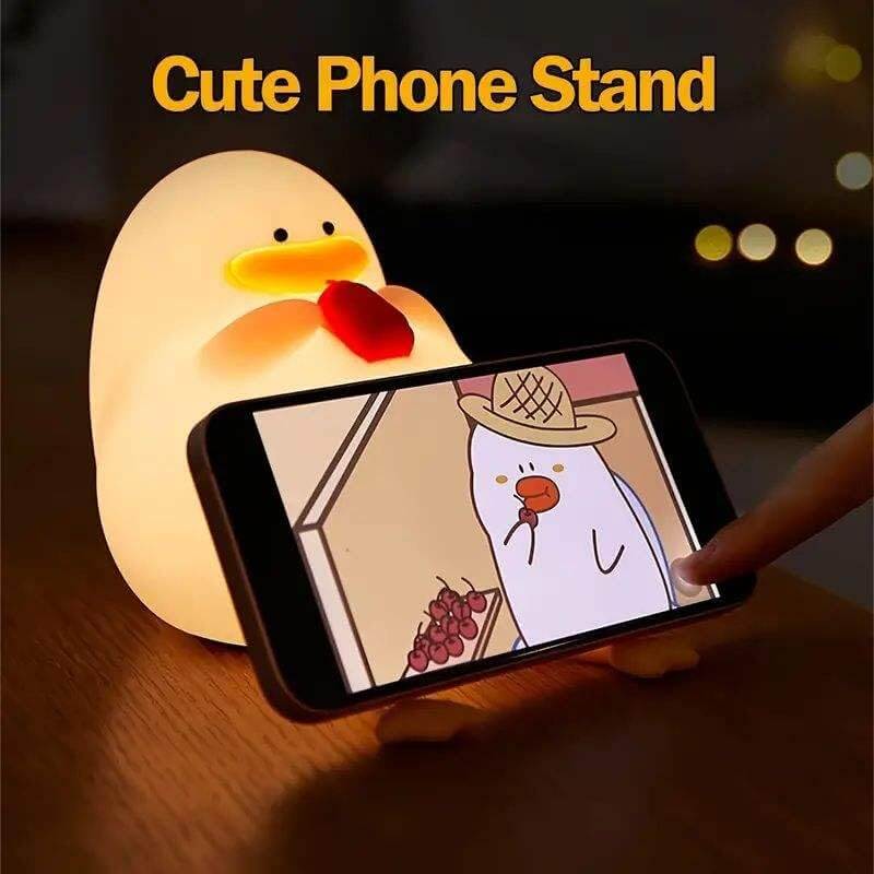 Cute duck night light with a hat, offering a warm and gentle glow for children's bedrooms. This soft-touch, rechargeable silicone lamp creates a cozy atmosphere, helping kids feel safe at night. www.usmile.com