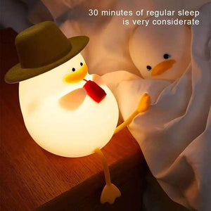 Cute duck night light with a hat, offering a warm and gentle glow for children's bedrooms. This soft-touch, rechargeable silicone lamp creates a cozy atmosphere, helping kids feel safe at night. www.usmille.com