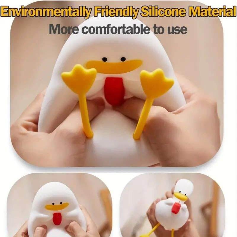 Duck shaped silicone night lamp with a yellow hat. www.usmile.com