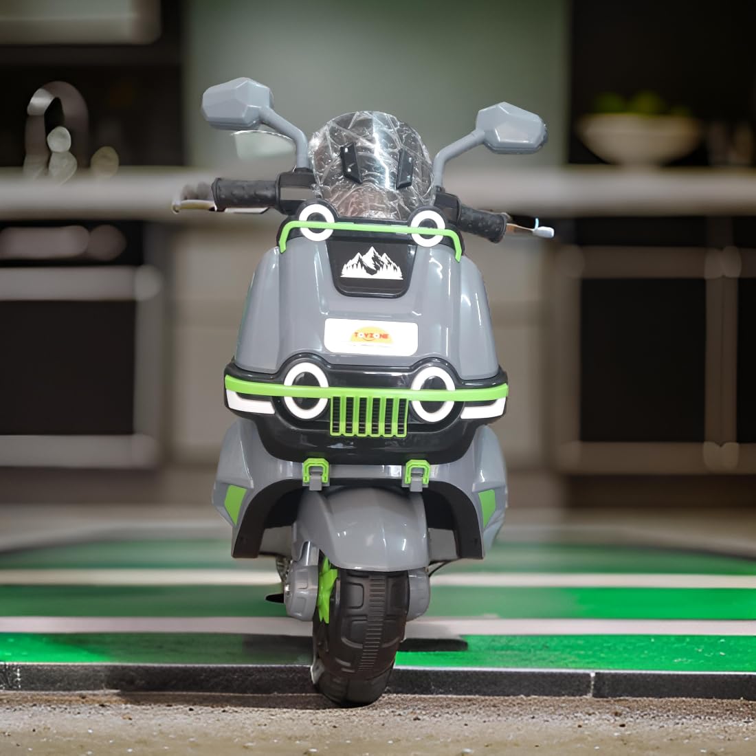 Toy motorcycle with gray and green design on a green surface Electric Bike for Kids | Electric Ride-On Scooter for Kids 1 to 6 Years www.usmile.toys 