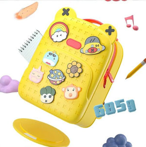 Front view of a fun, customizable silicone waterproof school bag for children, featuring a vibrant yellow color and various playful detachable badges like a rainbow, sun, and animals, ideal for kindergarten or primary school students from Usmile Toys.www.usmile toys