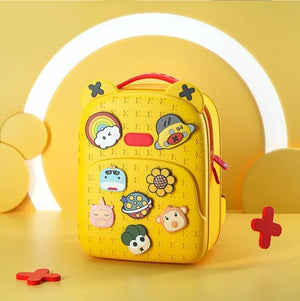 Bright yellow EVA kids school backpack with cartoon character pins and a textured surface, designed to be stylish, durable, and waterproof, perfect for daily school use from Usmile Toys.www.usmile.toys