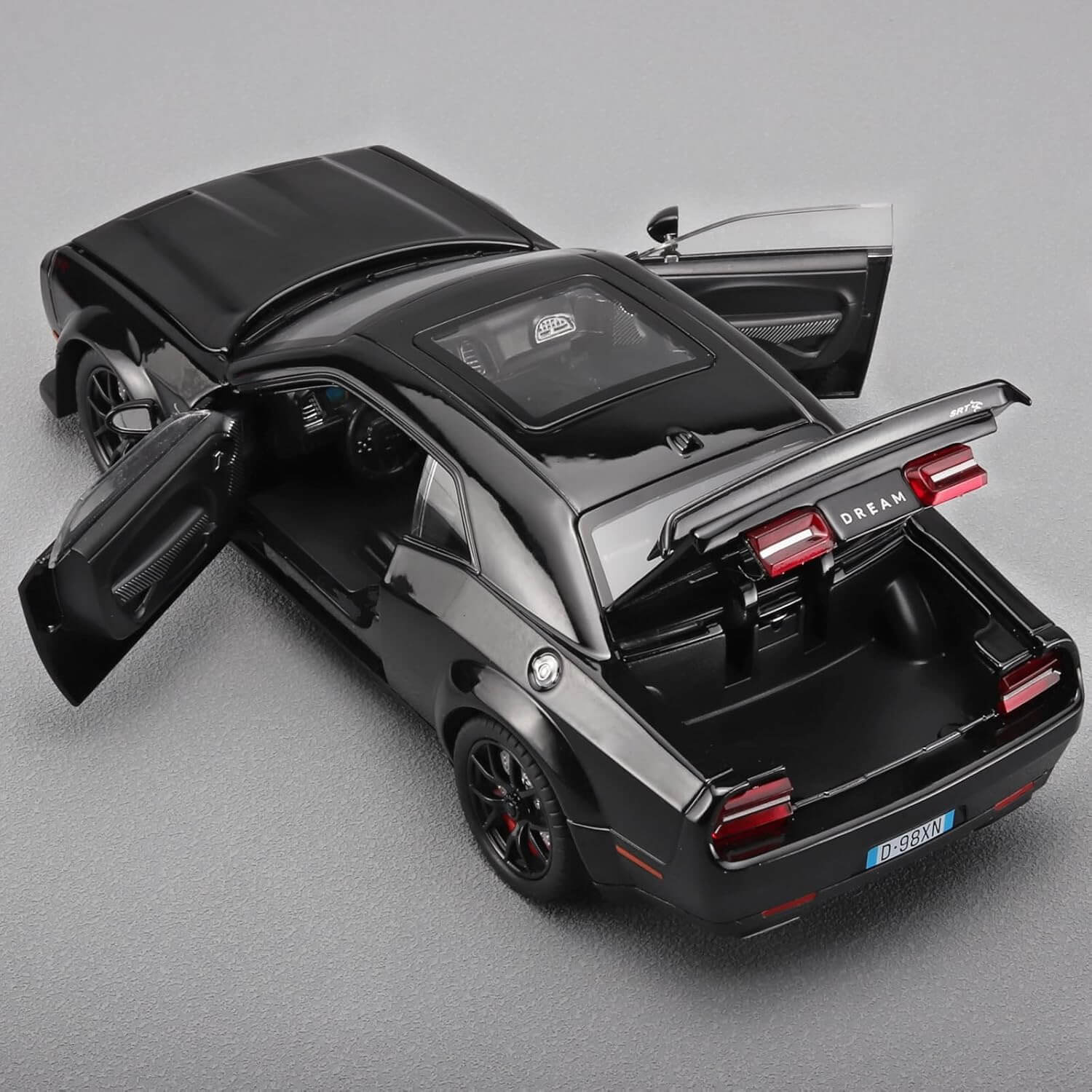 High-quality miniature replica of a powerful white muscle car (Dodge Challenger Hellcat style) with black wheels and red brake calipers, a durable pull-back toy ideal for vehicle enthusiasts from Usmile Toys www.usmile.toys