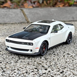 High-quality miniature replica of a powerful white muscle car (Dodge Challenger Hellcat style) with black wheels and red brake calipers, a durable pull-back toy ideal for vehicle enthusiasts from Usmile Toys. www.usmile.toys