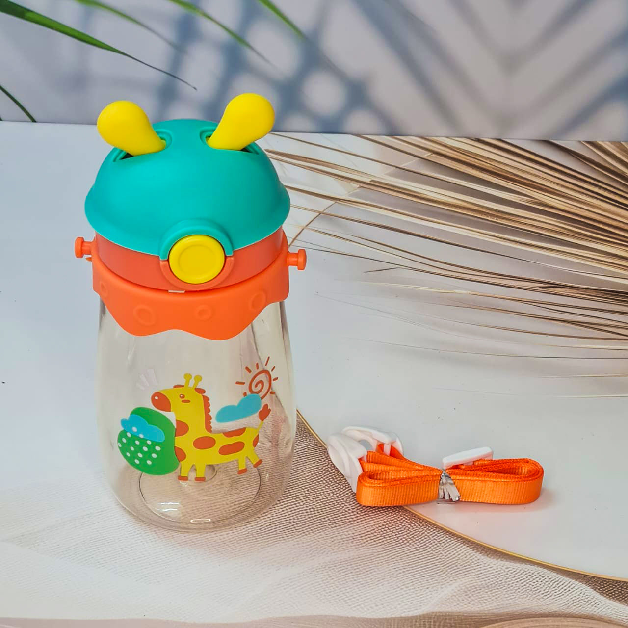 Set of three colorful kids water bottles with cute animal prints, featuring bunny, giraffe, and dragon designs. Each bottle includes a playful lid with 3D cartoon ears and comes with a matching strap for easy carrying. These BPA-free, leak-proof bottles are ideal for school, travel, and outdoor use—perfect addition to kids stationery and daily essentials