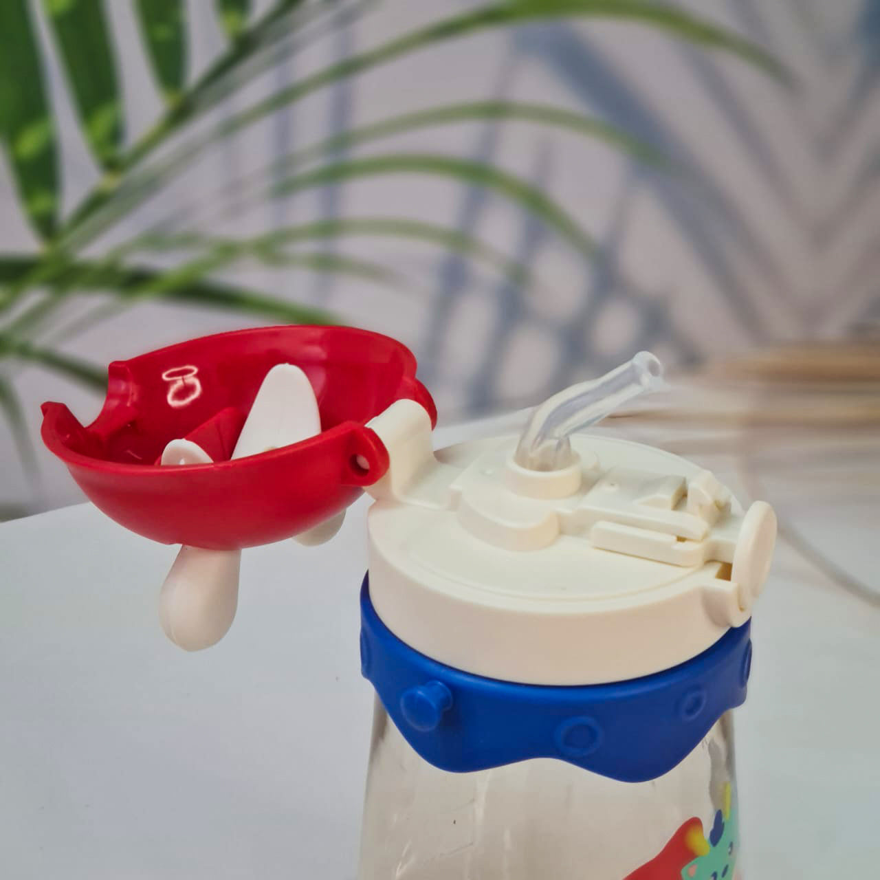 Set of three colorful kids water bottles with cute animal prints, featuring bunny, giraffe, and dragon designs. Each bottle includes a playful lid with 3D cartoon ears and comes with a matching strap for easy carrying. These BPA-free, leak-proof bottles are ideal for school, travel, and outdoor use—perfect addition to kids stationery and daily essentials