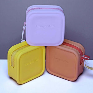 Three small square pouches in purple, yellow, and brown with 'tangoofun' branding on a light gray background.