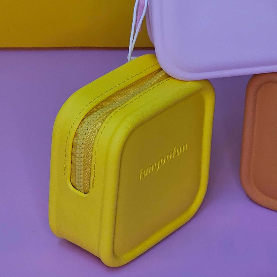 Yellow pouch with 'fungoofun' branding on a purple background