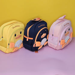 Set of three duckling backpacks for kids, yellow, navy blue, and pink, cartoon animal design, available at usmile.toys