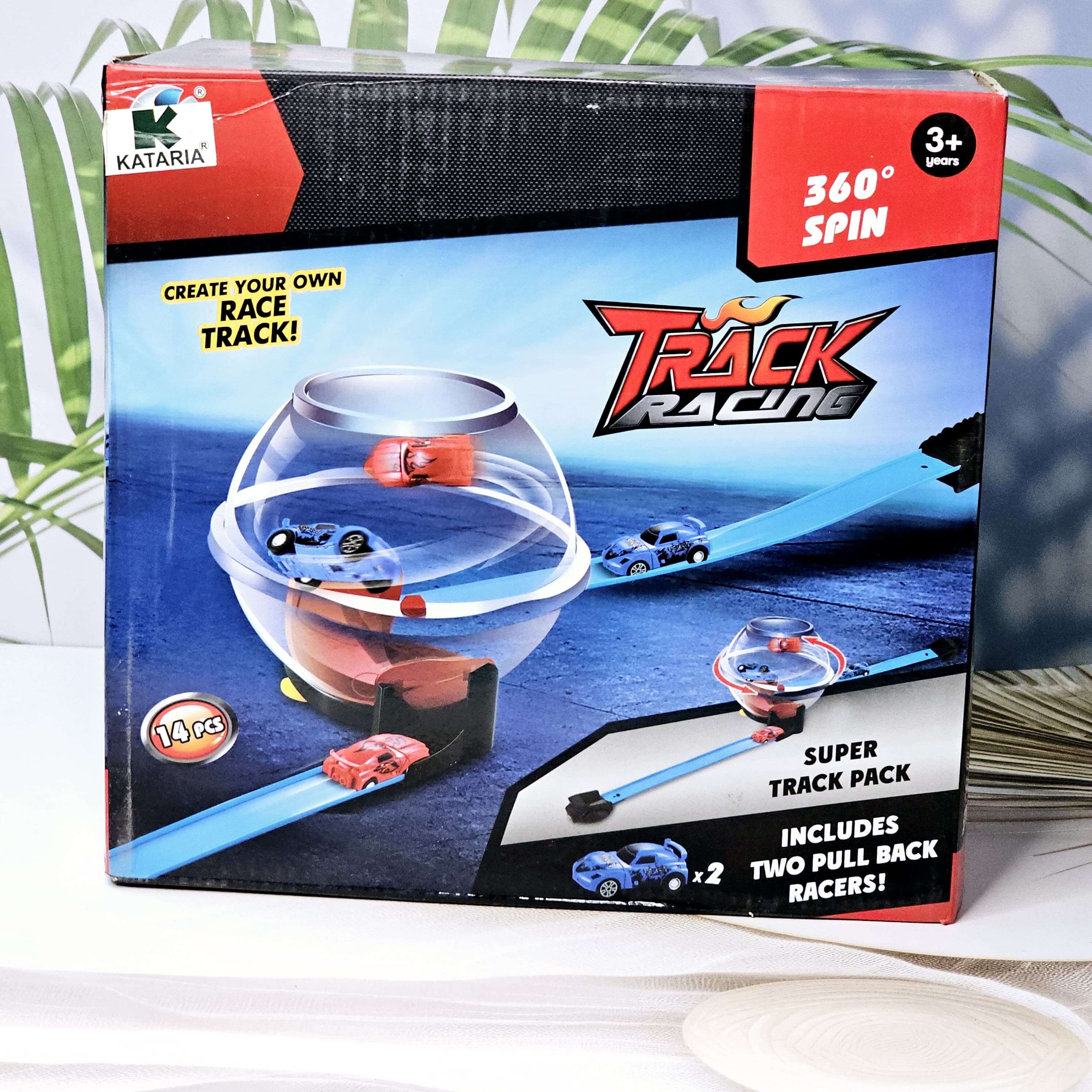 Kataria Globe Racing Super Stunt 360 Spinway Race Track playset. The box shows a transparent globe with cars, blue track pieces for creating a custom race track, and two included pull-back racers. Recommended for ages 3+ years, promoting imaginative play and fine motor skills.www.usmile.com