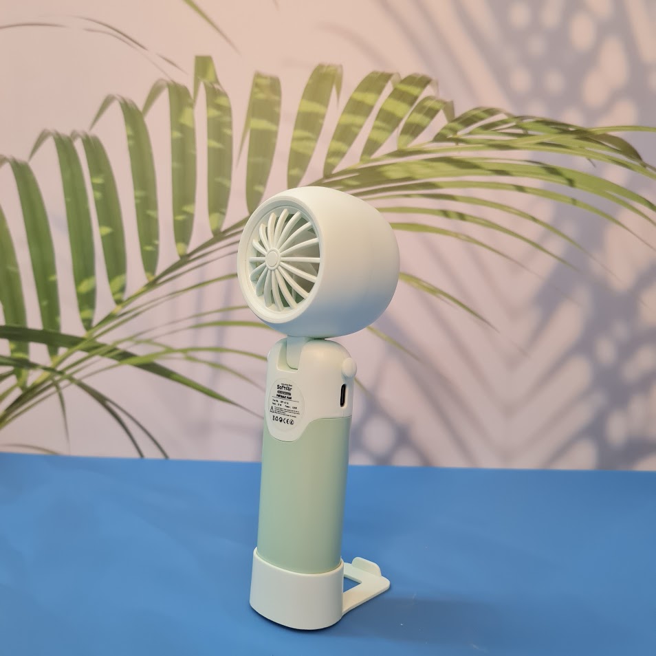 Colorful collection of portable bladeless mini fans for kids in pastel pink, green, blue with bear ears, and cream, designed with a child-safe bladeless head and single-button operation. These rechargeable USB fans are ideal for travel, school desks, or bedtime comfort, offering quiet and efficient cooling in a cute, compact design. Perfect return gift or utility item for children, available at U Smile Toys online store