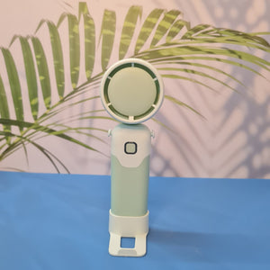 Colorful collection of portable bladeless mini fans for kids in pastel pink, green, blue with bear ears, and cream, designed with a child-safe bladeless head and single-button operation. These rechargeable USB fans are ideal for travel, school desks, or bedtime comfort, offering quiet and efficient cooling in a cute, compact design. Perfect return gift or utility item for children, available at U Smile Toys online store