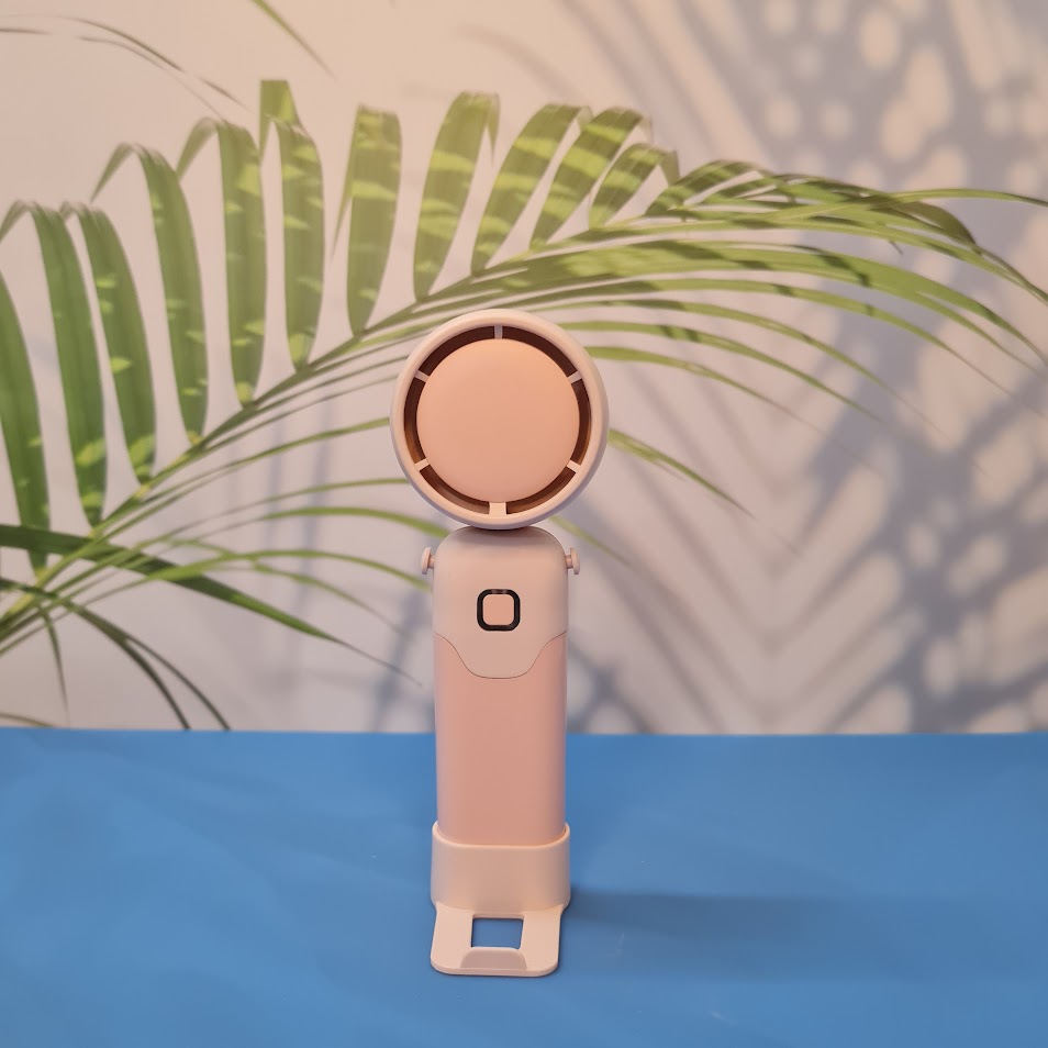 Colorful collection of portable bladeless mini fans for kids in pastel pink, green, blue with bear ears, and cream, designed with a child-safe bladeless head and single-button operation. These rechargeable USB fans are ideal for travel, school desks, or bedtime comfort, offering quiet and efficient cooling in a cute, compact design. Perfect return gift or utility item for children, available at U Smile Toys online store