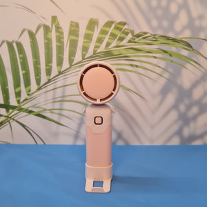 Colorful collection of portable bladeless mini fans for kids in pastel pink, green, blue with bear ears, and cream, designed with a child-safe bladeless head and single-button operation. These rechargeable USB fans are ideal for travel, school desks, or bedtime comfort, offering quiet and efficient cooling in a cute, compact design. Perfect return gift or utility item for children, available at U Smile Toys online store