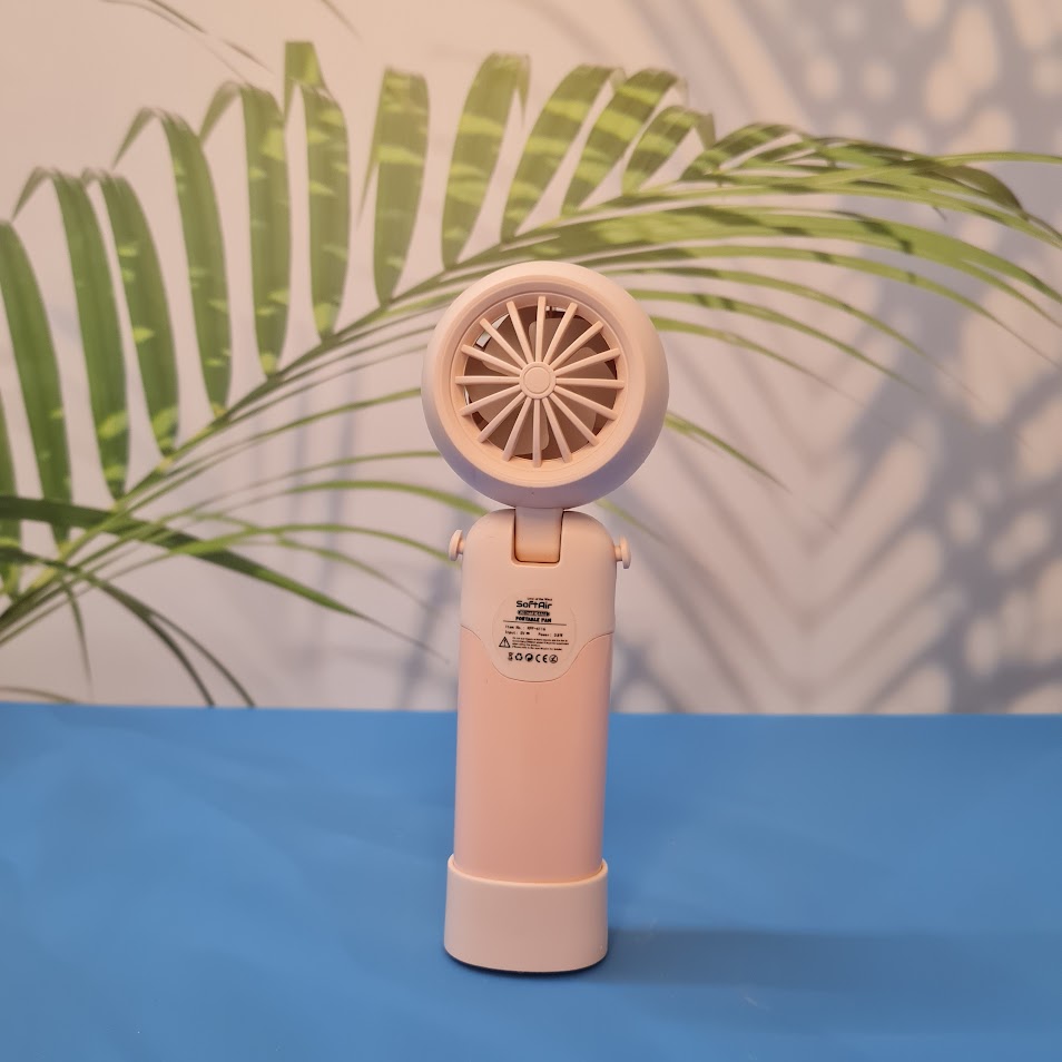 Colorful collection of portable bladeless mini fans for kids in pastel pink, green, blue with bear ears, and cream, designed with a child-safe bladeless head and single-button operation. These rechargeable USB fans are ideal for travel, school desks, or bedtime comfort, offering quiet and efficient cooling in a cute, compact design. Perfect return gift or utility item for children, available at U Smile Toys online store
