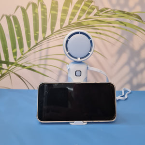 Colorful collection of portable bladeless mini fans for kids in pastel pink, green, blue with bear ears, and cream, designed with a child-safe bladeless head and single-button operation. These rechargeable USB fans are ideal for travel, school desks, or bedtime comfort, offering quiet and efficient cooling in a cute, compact design. Perfect return gift or utility item for children, available at U Smile Toys online store