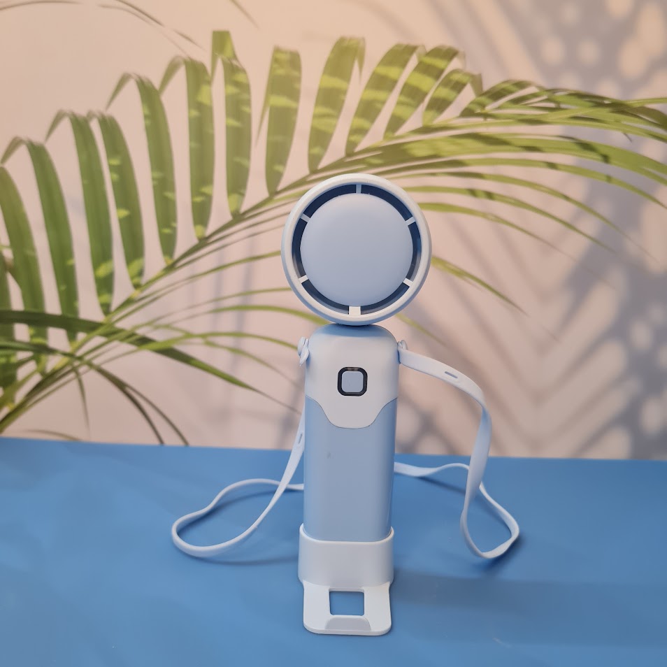 Colorful collection of portable bladeless mini fans for kids in pastel pink, green, blue with bear ears, and cream, designed with a child-safe bladeless head and single-button operation. These rechargeable USB fans are ideal for travel, school desks, or bedtime comfort, offering quiet and efficient cooling in a cute, compact design. Perfect return gift or utility item for children, available at U Smile Toys online store