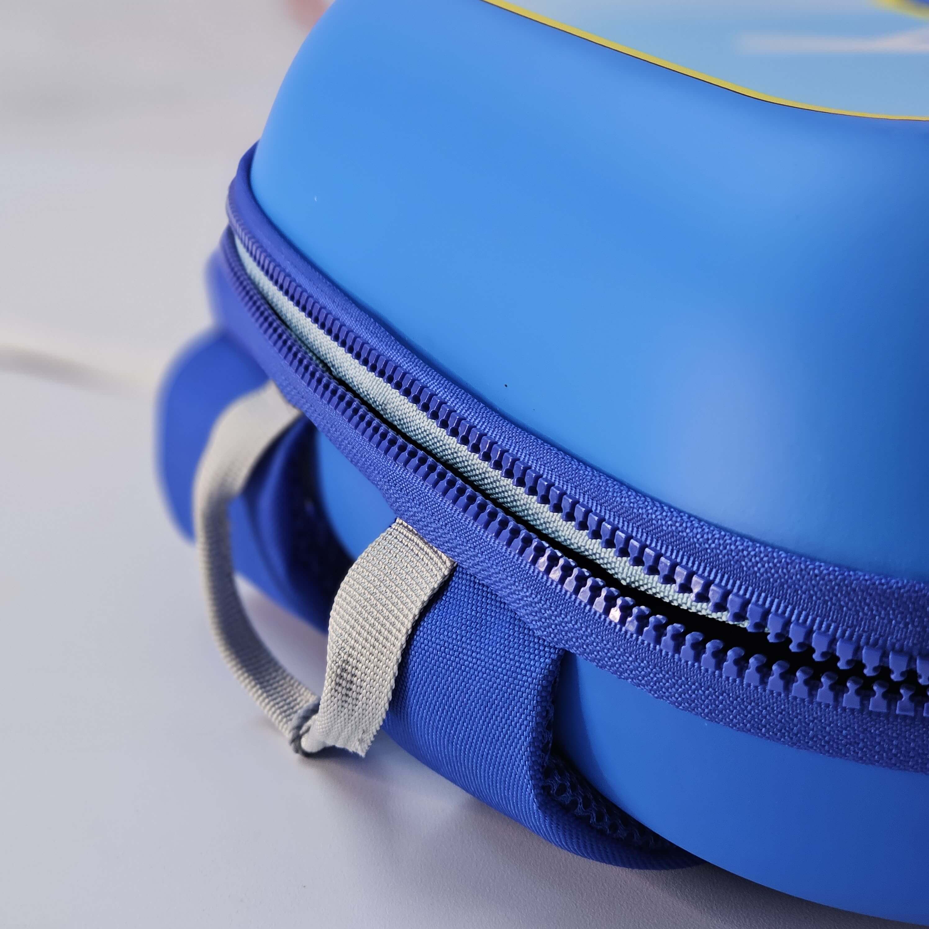 Blue round pouch with a zipper on a light gray background