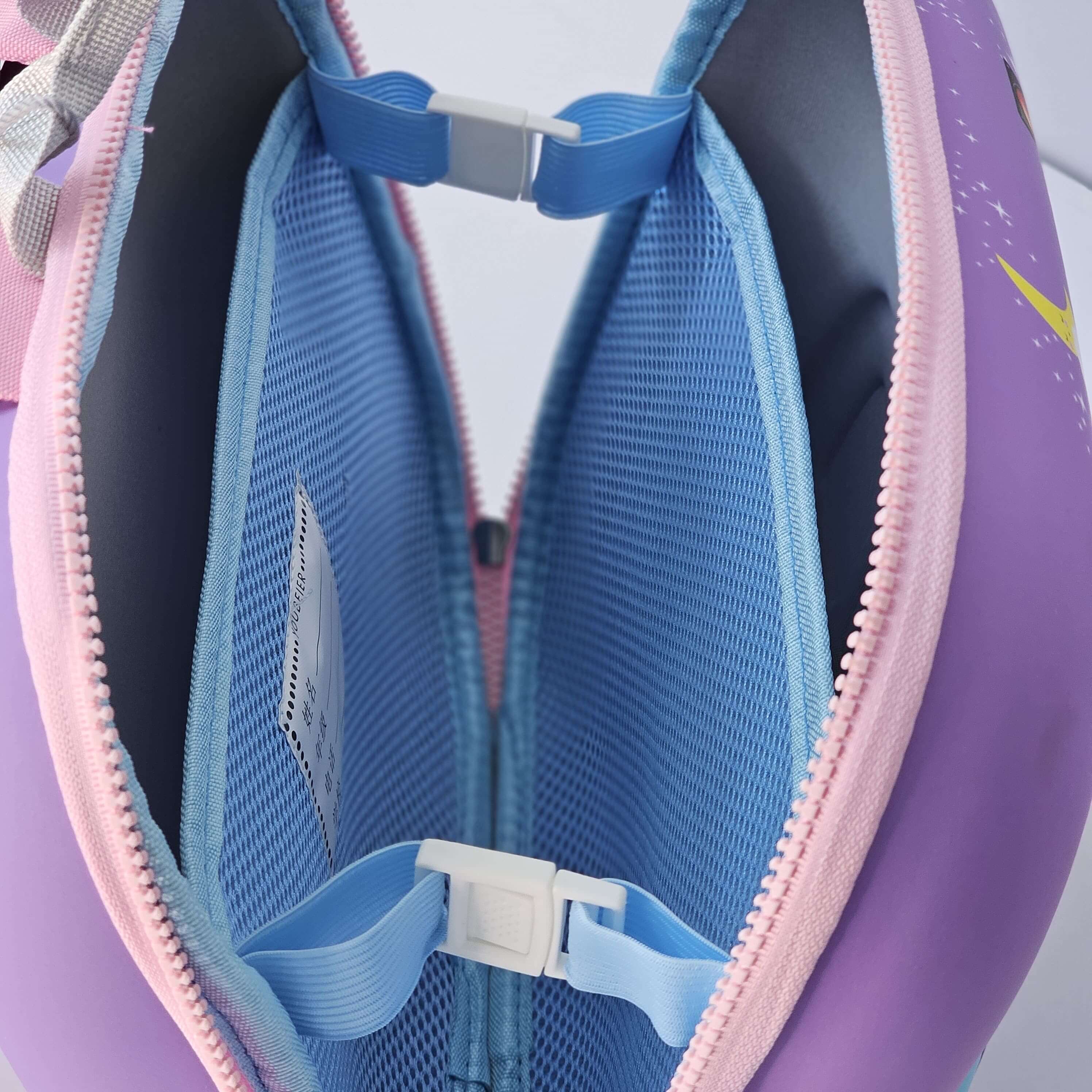 Close-up of a purple and blue bag with a visible brand logo.