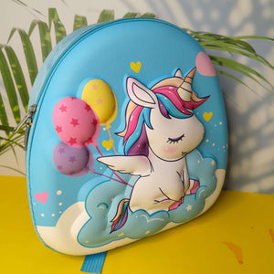 Children's backpack with a unicorn design on a yellow surface with plants in the background