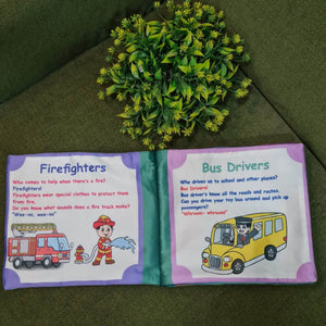 An open "Our Helping Heroes" fabric book by Kidogen, displaying pages about "Police Officers" and "Doctors and Nurses" with illustrations of community helpers and descriptive text.