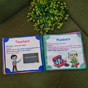 An open "Our Helping Heroes" fabric book by Kidogen, displaying pages about "Police Officers" and "Doctors and Nurses" with illustrations of community helpers and descriptive text.