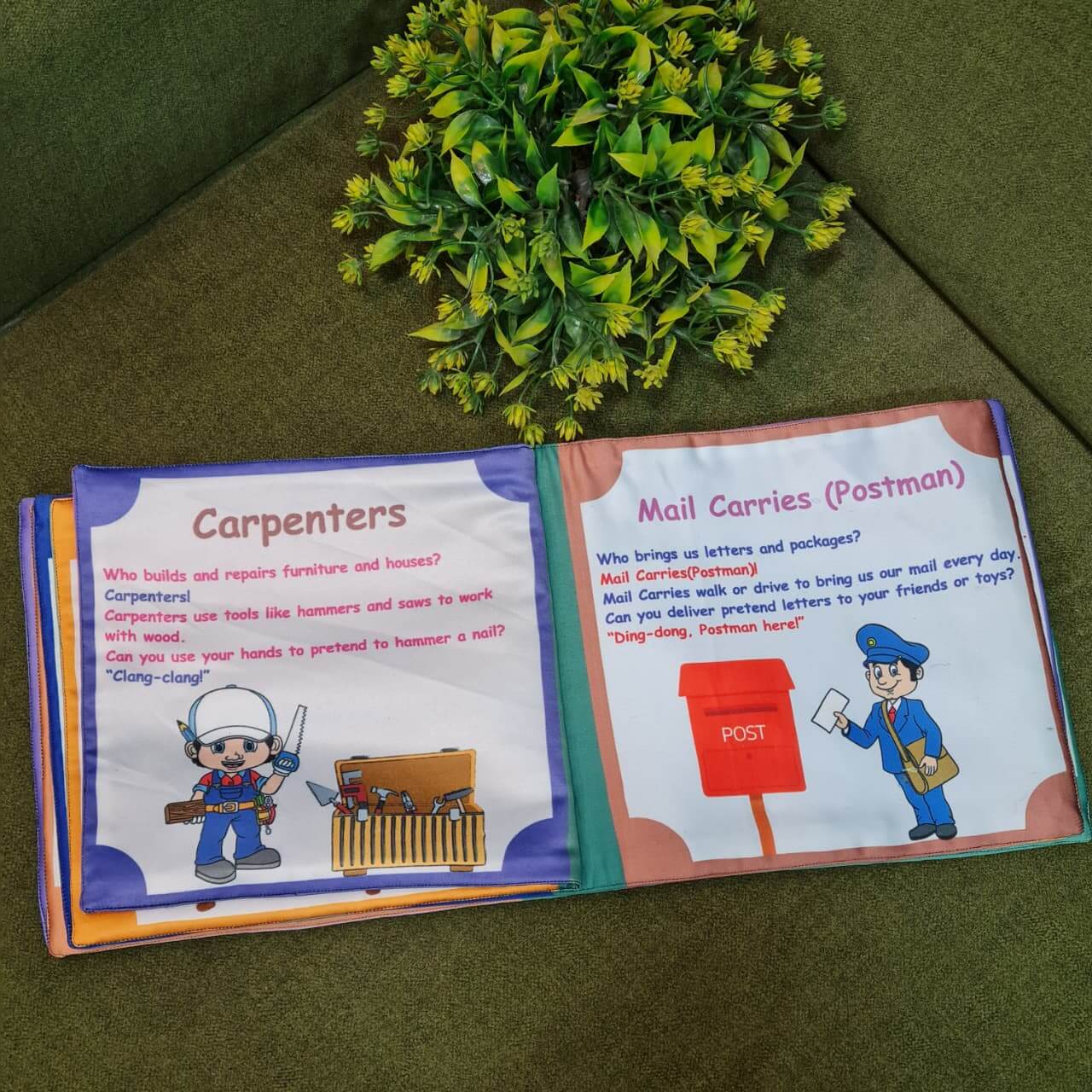 An open "Our Helping Heroes" fabric book by Kidogen, displaying pages about "Police Officers" and "Doctors and Nurses" with illustrations of community helpers and descriptive text.
