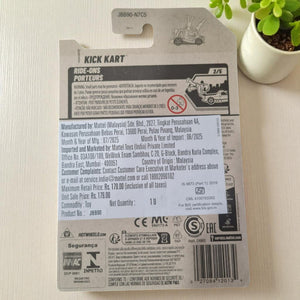 Back of a toy packaging with branding and product details on a light surface.