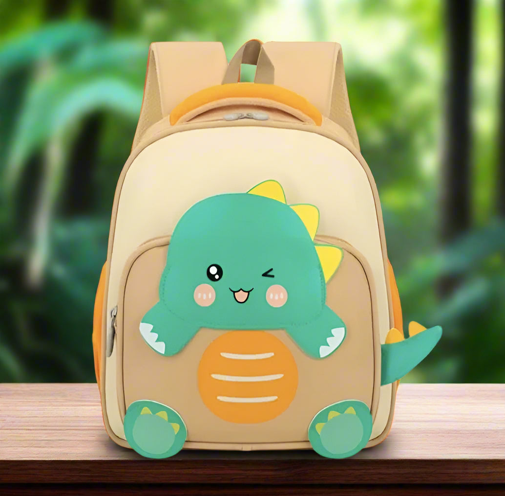 "Usmile Toys pre-school backpack for kids, featuring an adorable light blue and green dinosaur with yellow spikes on a beige bag."www.usmile.toys