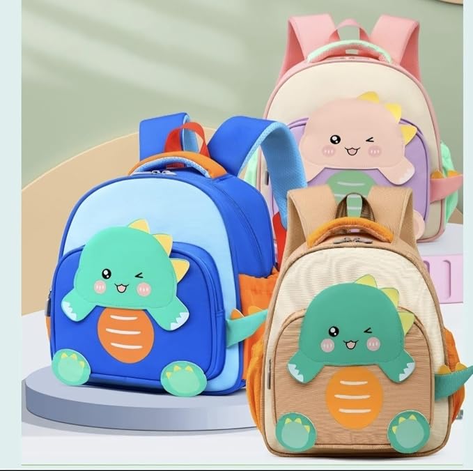 Usmile Toys pre-school backpack for kids, featuring an adorable light blue and green dinosaur with yellow spikes on a beige bag."www.usmile.toys