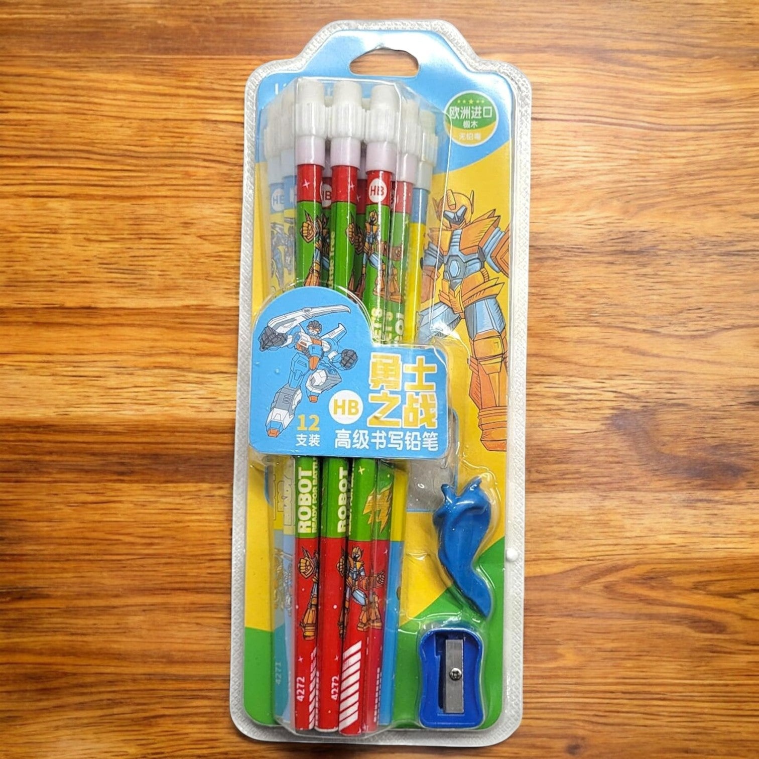 "Usmile Toys Cartoon Theme Kids' Stationery Kit in clear packaging, featuring wooden HB pencils with construction vehicles, a truck-shaped eraser, and a red sharpener." www.usmile.toys