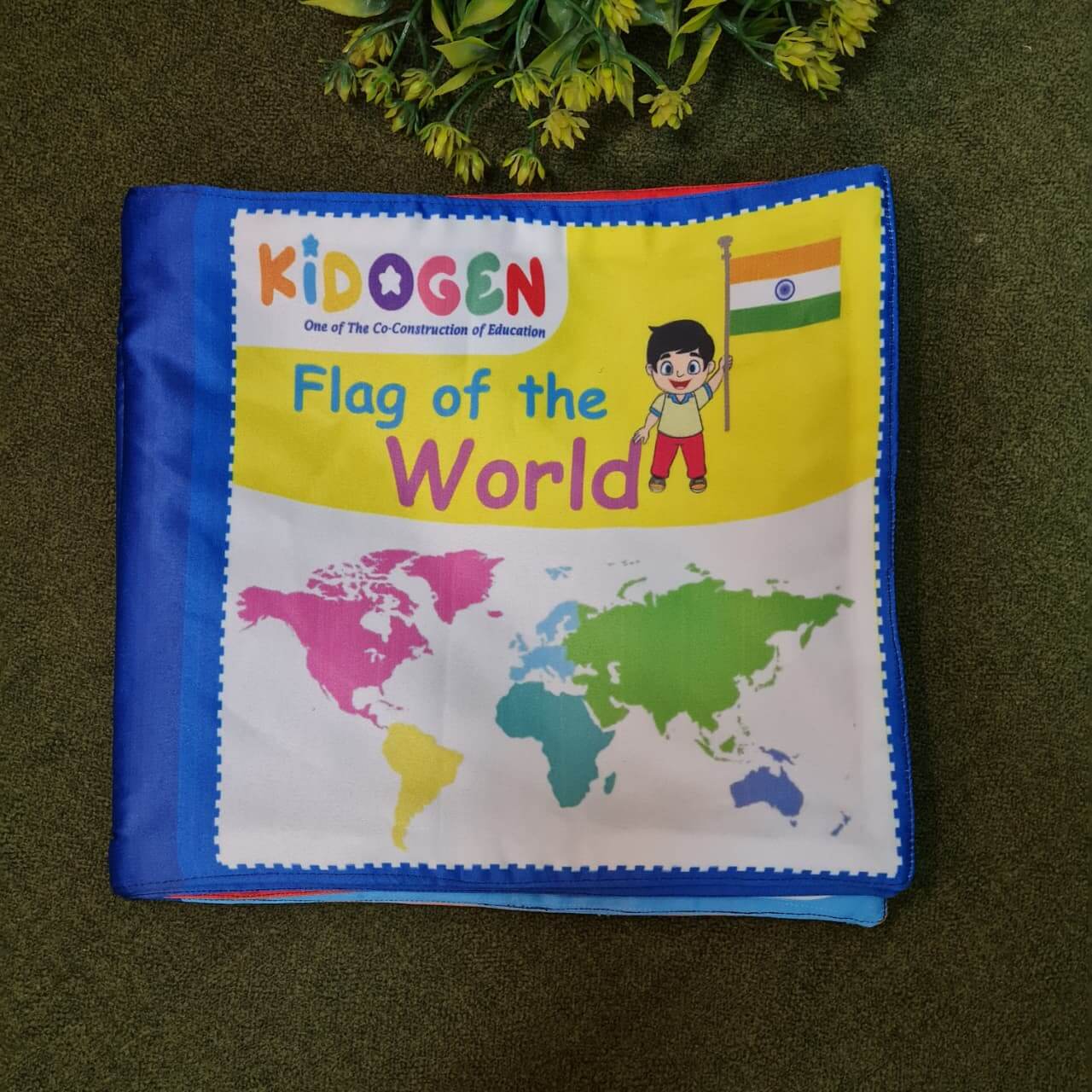 "Flag of the World" fabric book by Kidogen, displaying pages about India, USA, Italy, and the United Kingdom with their flags, landmarks, and descriptive rhymes.