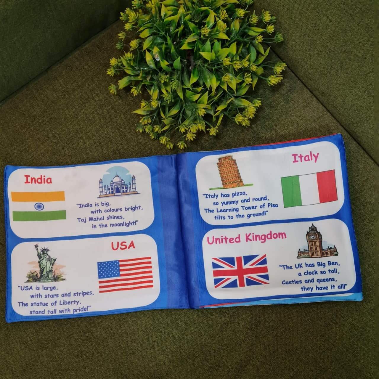 "Flag of the World" fabric book by Kidogen, displaying pages about India, USA, Italy, and the United Kingdom with their flags, landmarks, and descriptive rhymes.