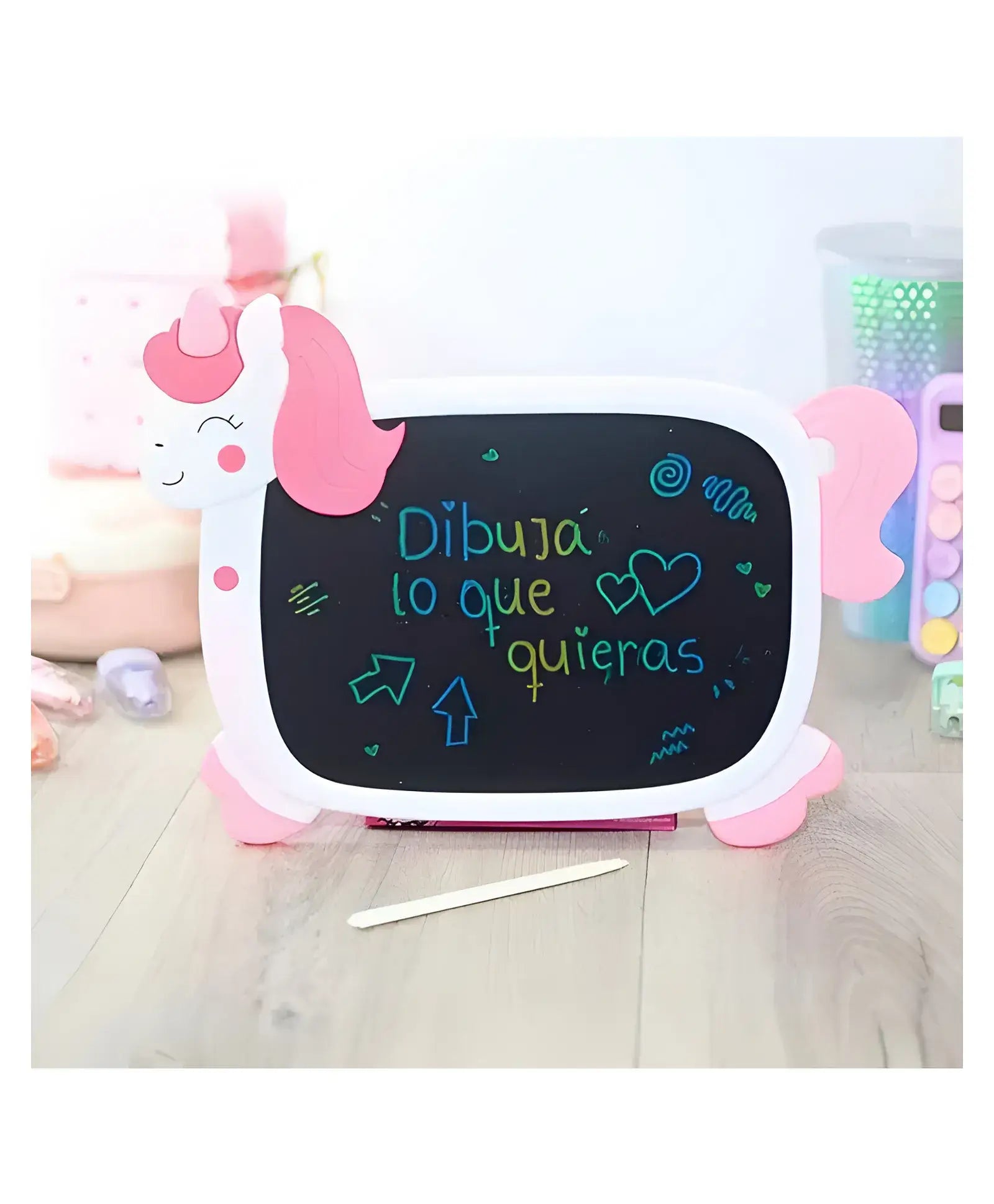 Magical unicorn-shaped LCD writing board for kids, featuring a white body with pink accents like the horn, mane, and hooves. The black screen displays "Pizarra LCD" written in green, making it a perfect reusable drawing tablet and educational toy for toddlers and children.www.usmile.com