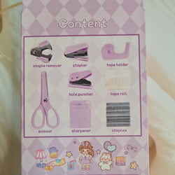 Adorable 9-piece Kawaii mini stationery gift set in pastel purple theme, perfect for school kids and return gift ideas – includes stapler, staple remover, hole puncher, tape holder with tape roll, sharpener, scissor, and a box of staples. Packaged in a beautifully designed cartoon-themed gift box with cute illustrations and soft pink-purple tones. Ideal for girls aged 5 and above who love fun and functional stationery items – available at U Smile Toys India