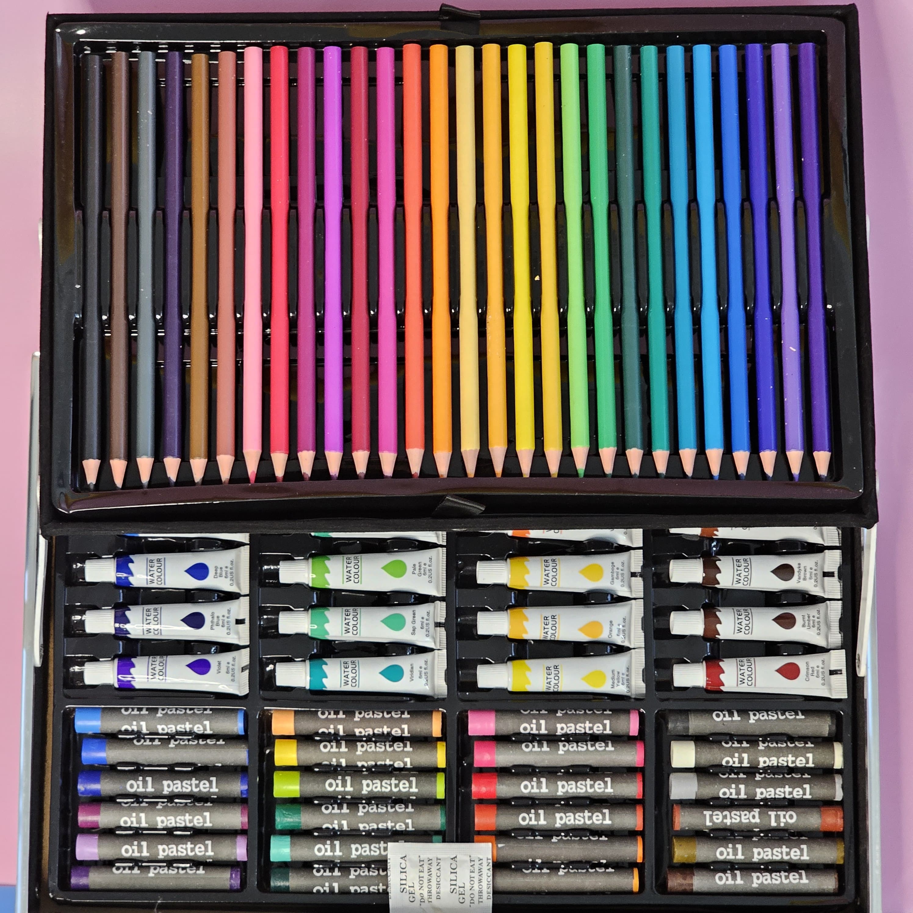 Kids' unicorn art set with markers, crayons, paints, and brushes. Portable art supplies for children, available at usmile.toys