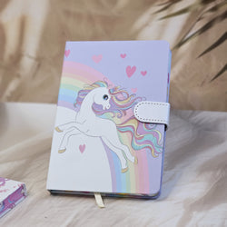 Four colorful pocket-sized diaries with unicorn illustrations, including a light blue diary that reads 'TIME TO BE A UNICORN', each with a clasp lock www.usmile.toys