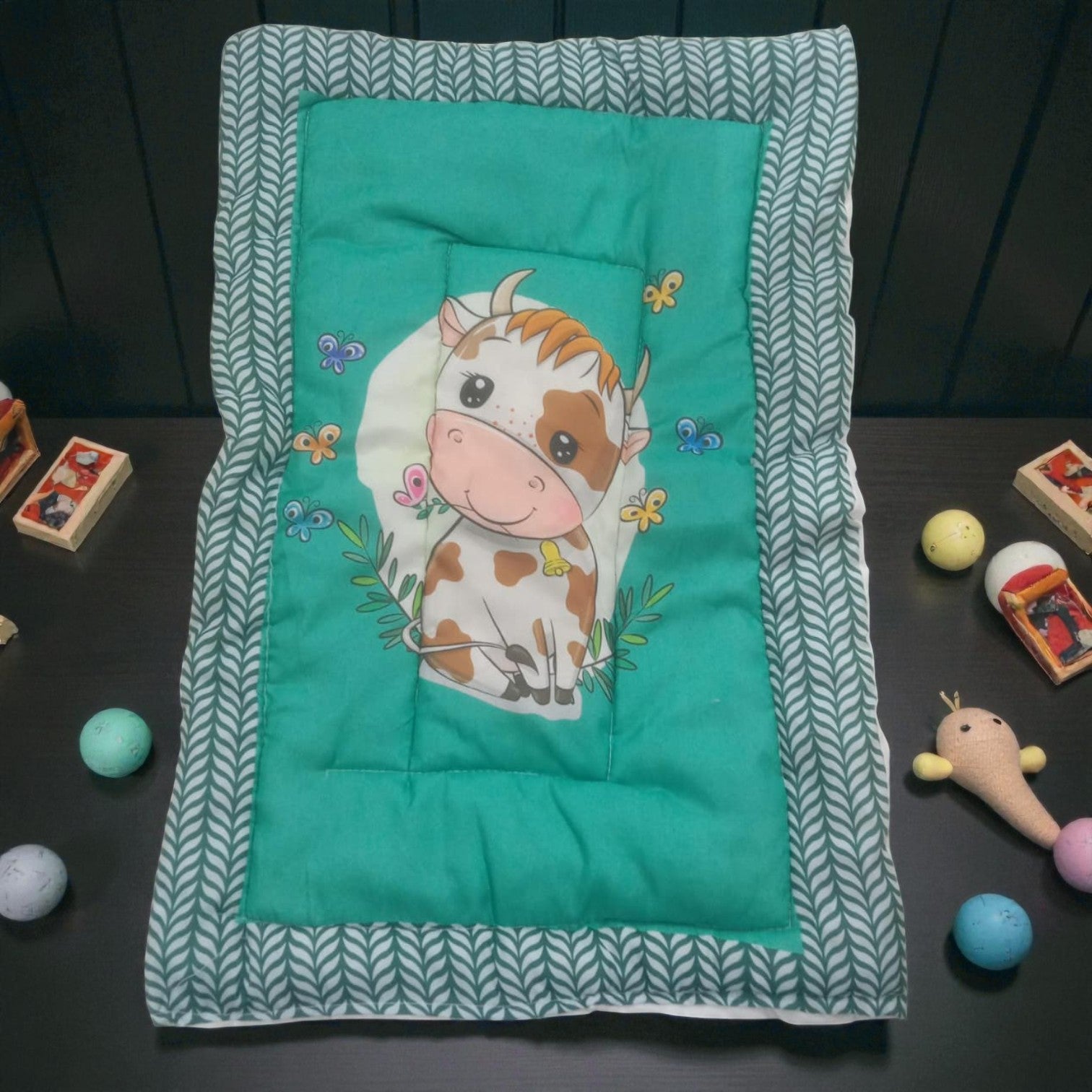 "Variety pack of five handmade baby godadi (quilts) with colorful cartoon prints including animals, rabbits, and a cow, ideal for newborns and tummy time." www.usmile.toys