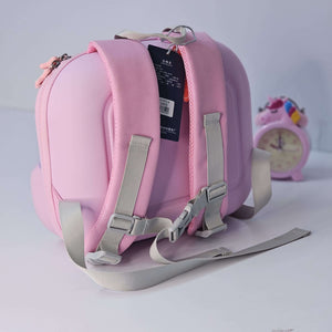 Pink children's backpack with gray straps on a light gray background