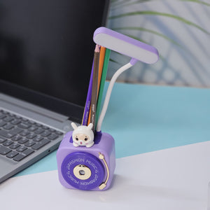 Streamline your child's study space with the Usmile Toys 3-in-1 LED desk lamp. This innovative solution combines a bright reading light with a practical pen holder and pencil sharpener, keeping school supplies neat and accessible for focused learning." www.usmile.toys