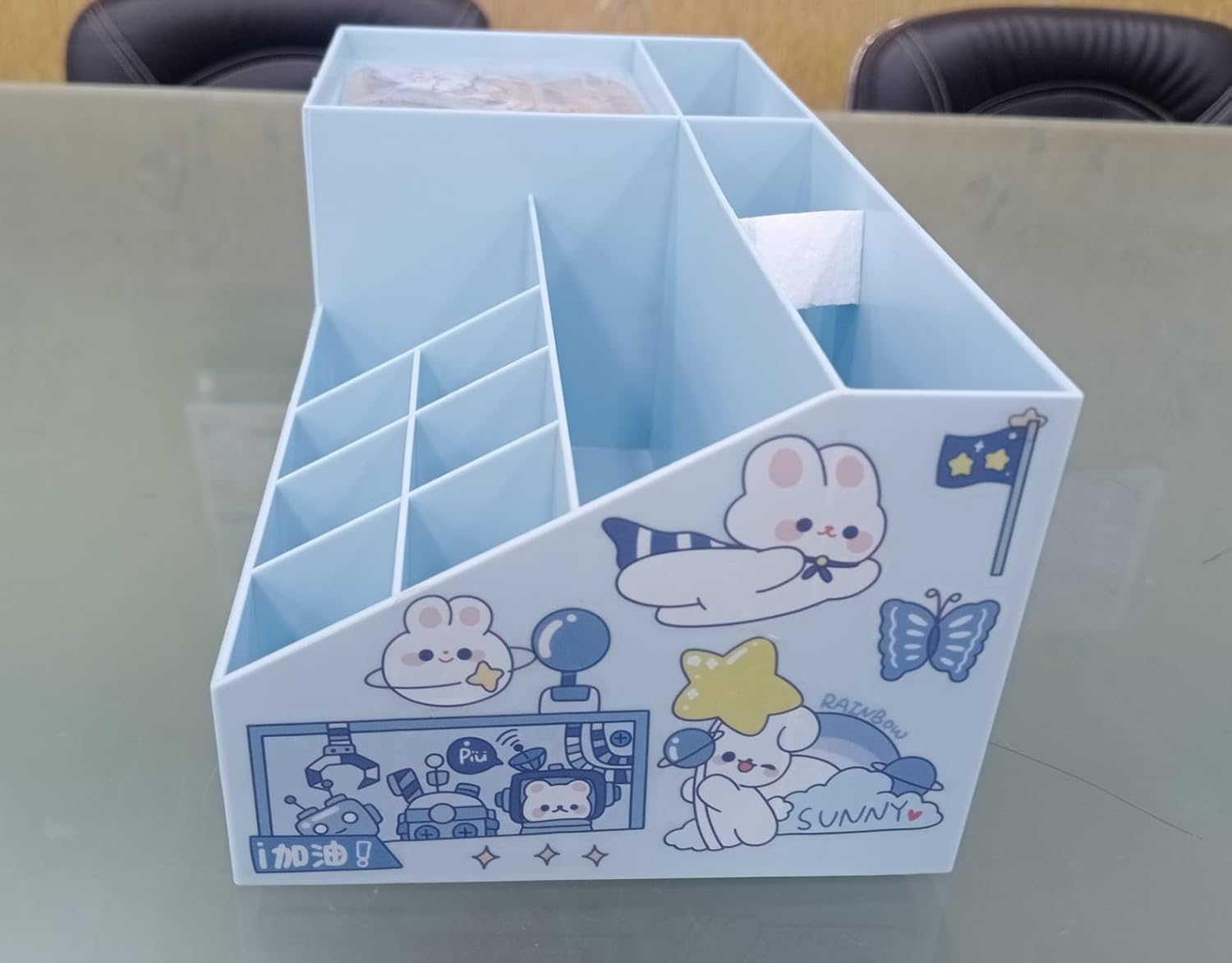 Desk organizer with cartoon designs on a desk