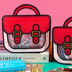 Cute cartoon schoolbag shaped plastic gift bags with handles, perfect for party favors and small gifts for kids in www.usmile.toys