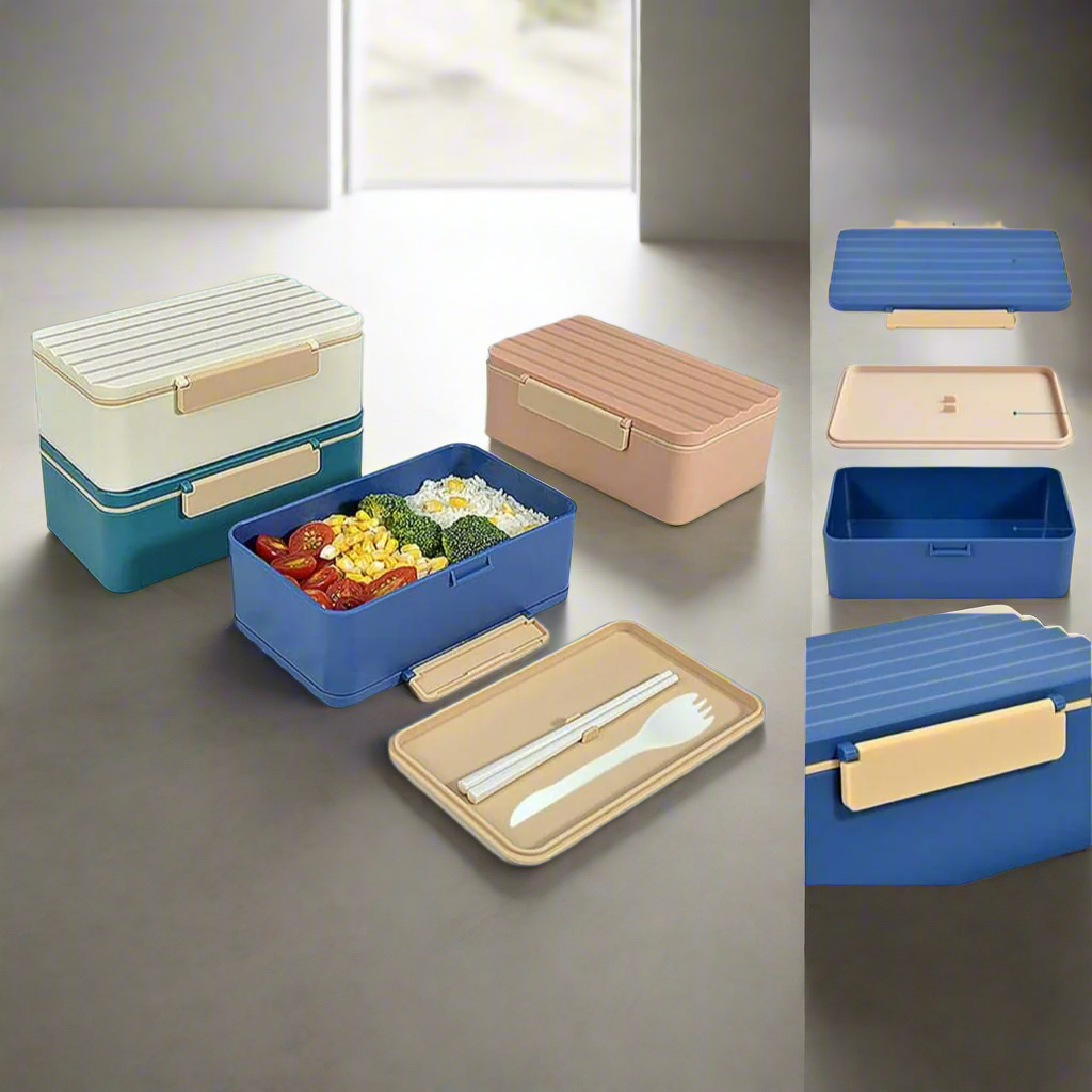 Stackable plastic bento lunch boxes for kids, available in blue/cream and terracotta, with removable dividers and included cutlery. www.usmile.toys