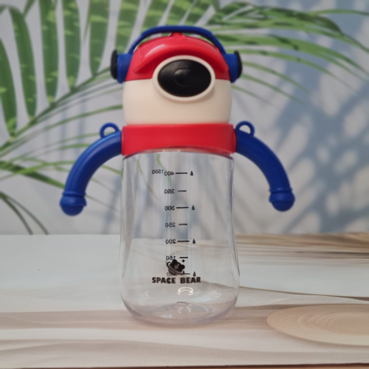  Colorful Space Bear kids' water bottles with integrated straws and ergonomic handles, featuring fun headphone-wearing bear designs on the caps. Perfect for hydration at school or on the go. www.usmile.toys