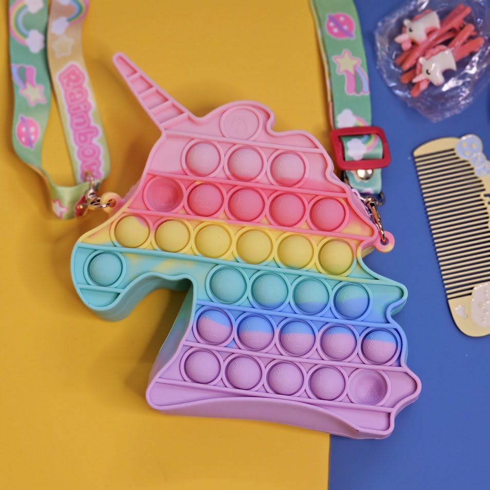 Unicorn Pop It Purse set, a delightful combination of a trendy sensory toy and a cute accessory, perfect for little unicorn lovers! This set, likely featured on www.usmile.toys for its fun
