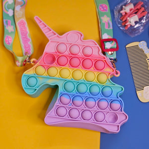 Unicorn Pop It Purse set, a delightful combination of a trendy sensory toy and a cute accessory, perfect for little unicorn lovers! This set, likely featured on www.usmile.toys for its fun