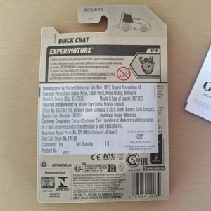 Back of a toy package with branding and product details on a wooden surface